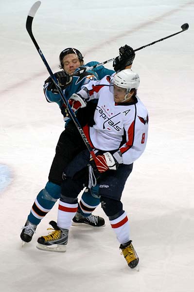 Washington Capitals left wing Alexander Ovechkin checks San Jose Sharks defenseman Douglas Murray hockey hit